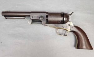 Historic Colt 2nd Model Dragoon percussion revolver in .44 caliber with "New Hampshire" markings, a pleasing patina, and wood grips.