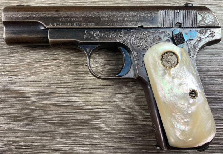 Engraved Colt Model 1903 Pocket Hammerless .32 Rimless Smokeless semi-auto pistol with factory pearl grips, circa 1911